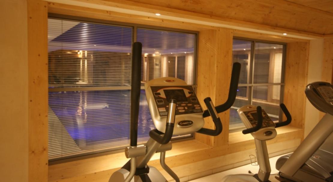 The fitness suite overlooking the swimming pool at Le Village de Lessy, Le Grand-Bornand/ Chinaillon, France