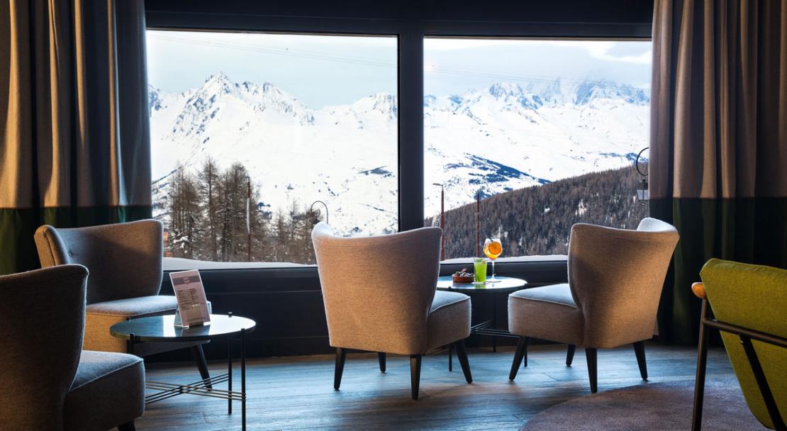 Lobby reception lounge Hotel Araucaria armchairs mountain view La Plagne